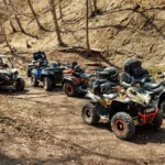 quad-atv-cars-all-terrain-vehicle-parked-mountain-road